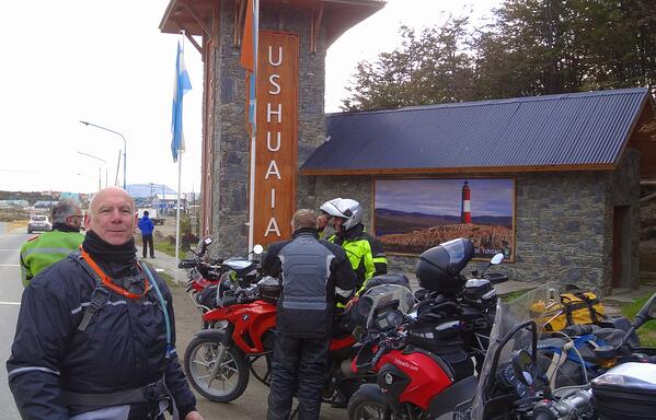 Riders at entrance to Ushuaia Argentina