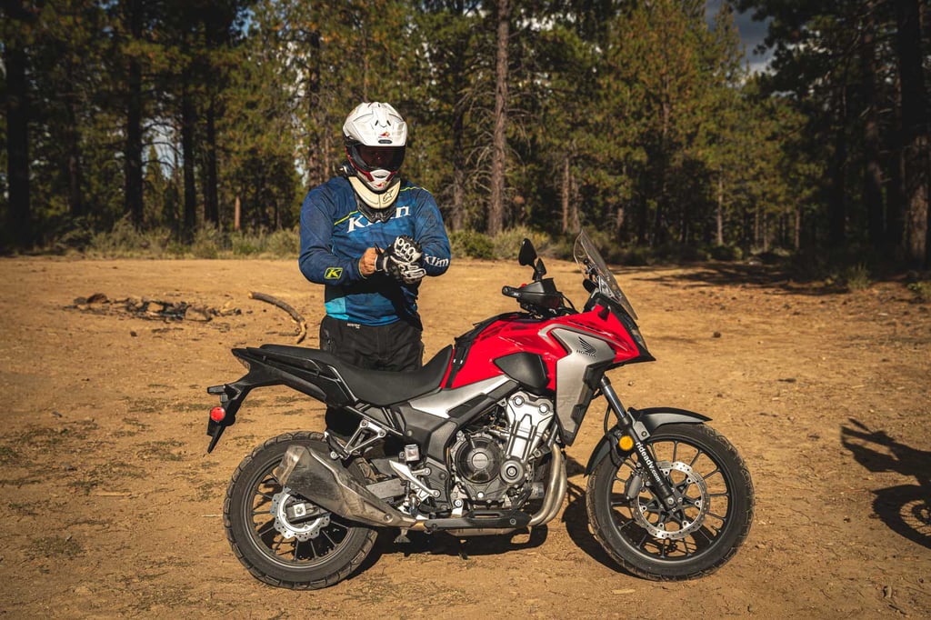 Eric with the Shoei Hornet X2 helmet putting on gloves getting ready to ride