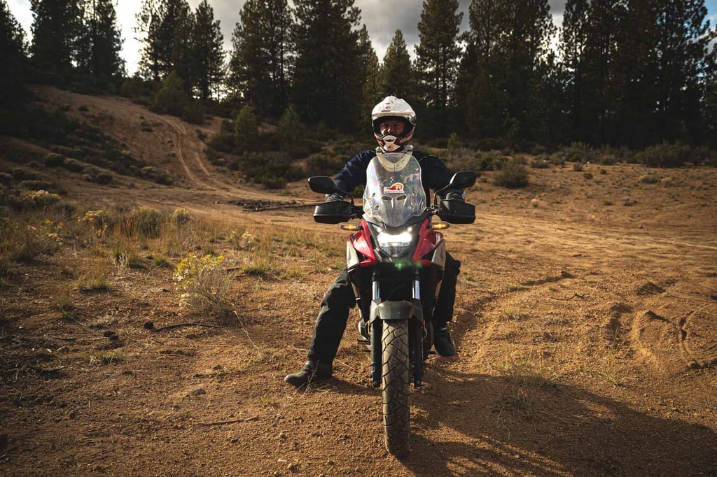 Eric sitting on his Adventure Motorcycle looking out onto the horizon