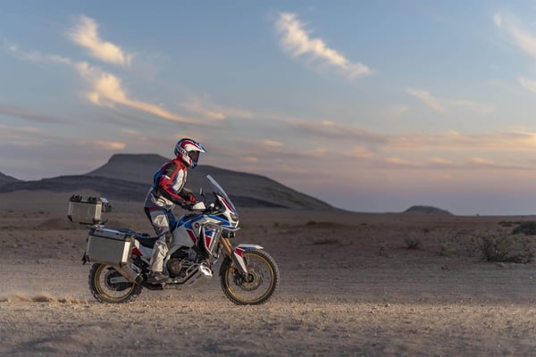 Rider in the desert at sunset on a 2020 Honda Africa Twin