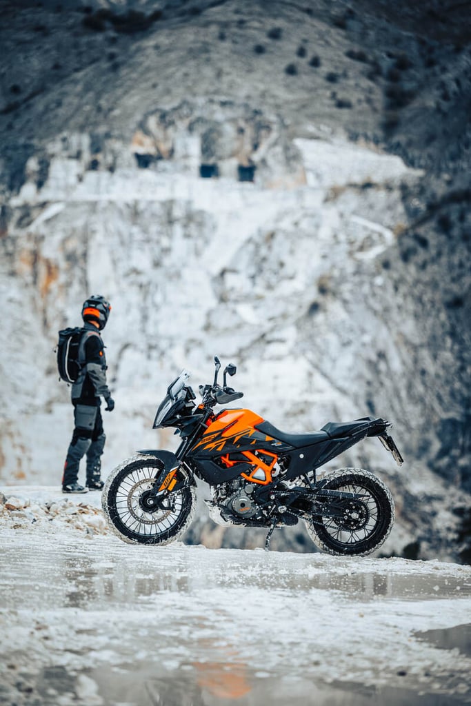 2023-ktm-390-adventure-rider-standing-in-desert