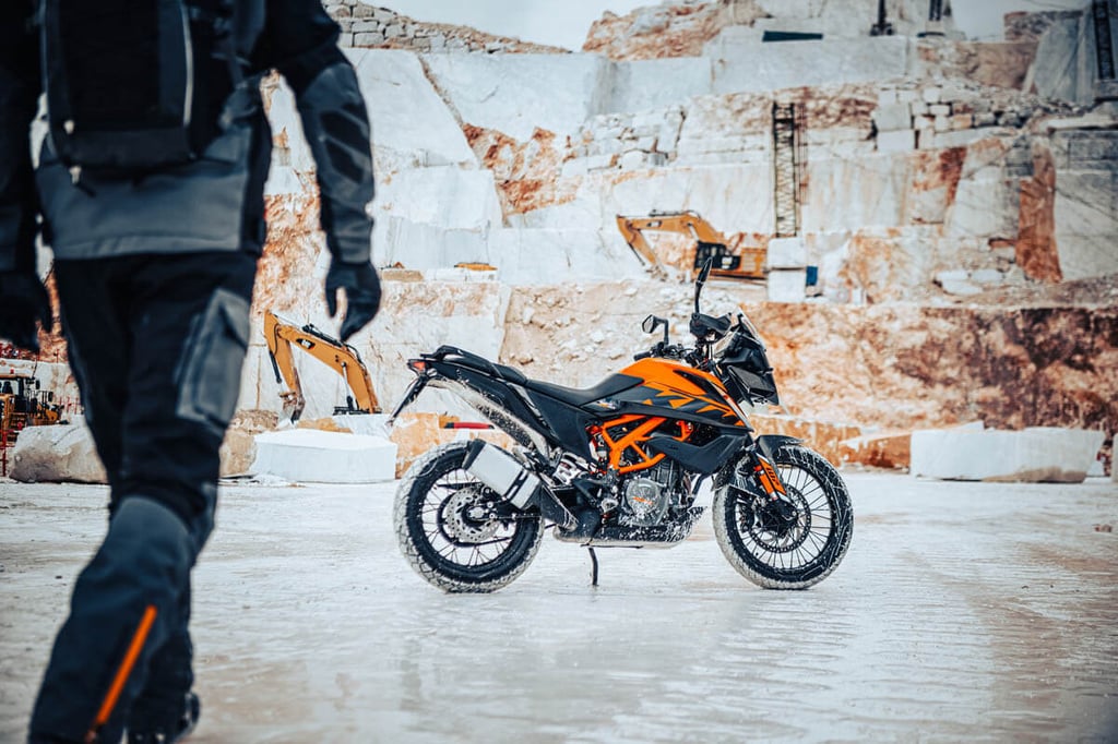 2023-ktm-390-adventure-rider-walking-towards-bike