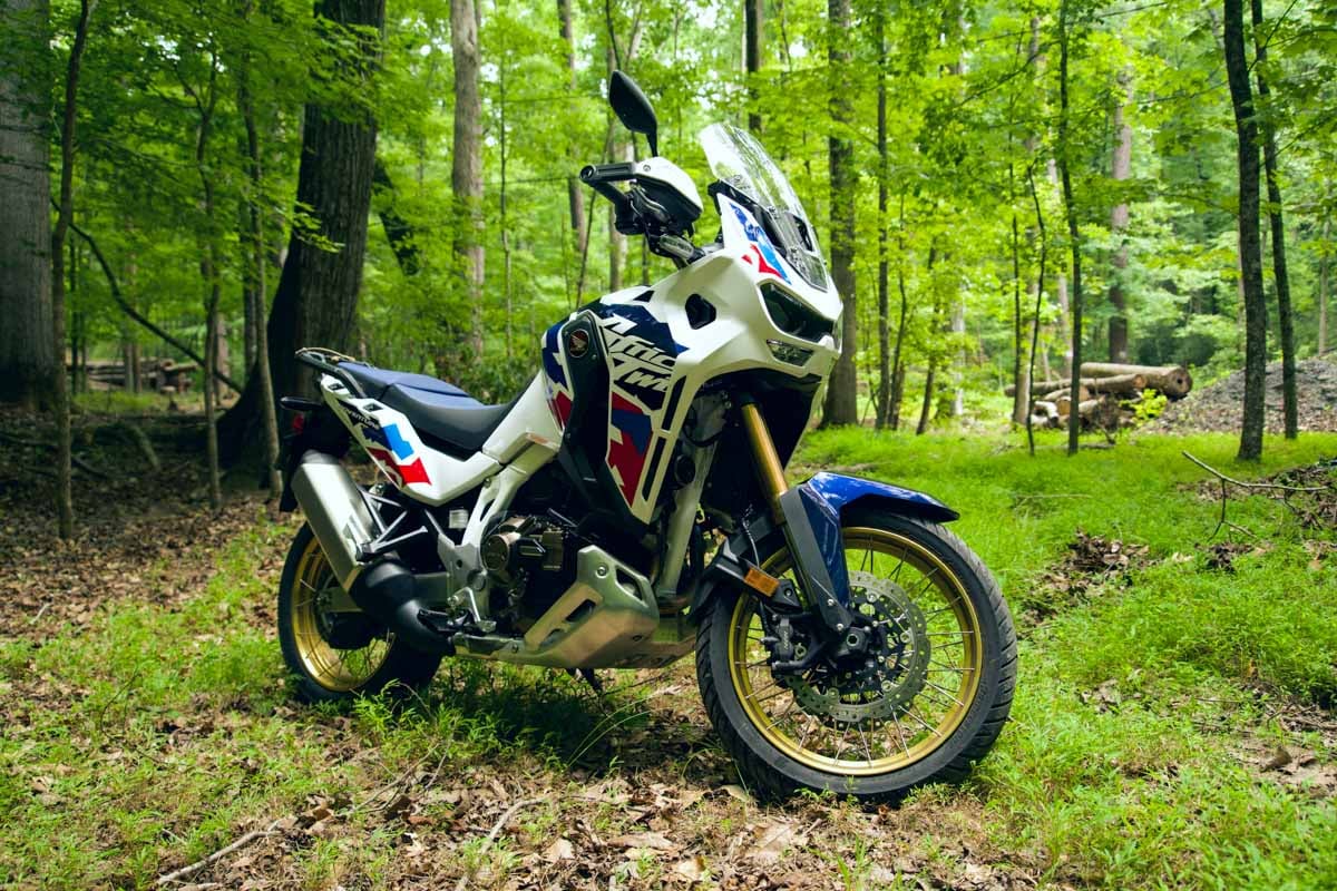 2024-honda-africa-twin-dct-side-profile-in-the-forest