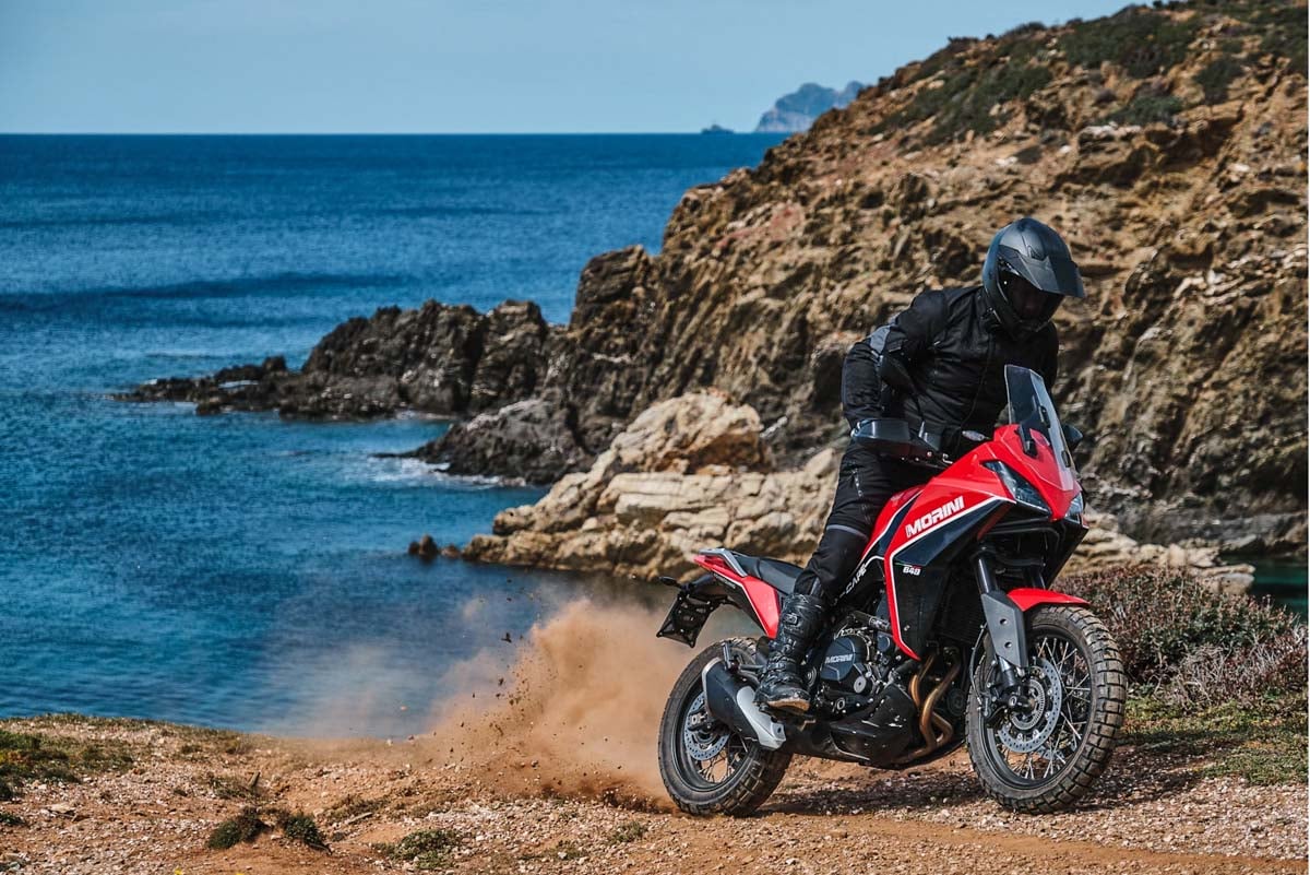2025-moto-morini-x-cape-1200-rider-along-ocean
