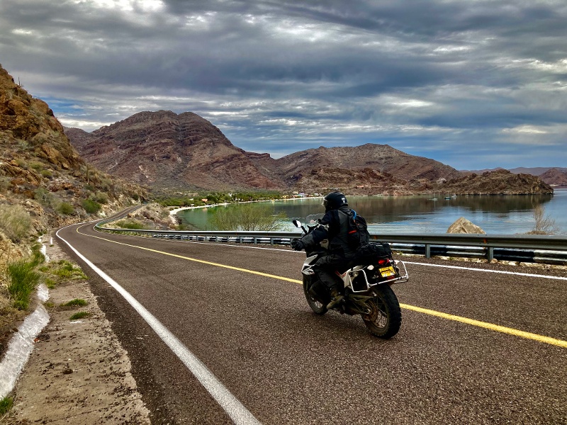 ADV rider in Baja Sur near the water on pavement. 