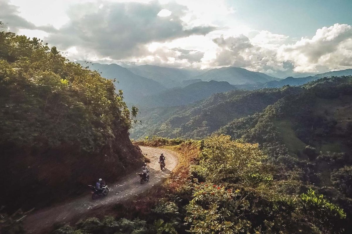 3 adventure riders offroad high up in the mountains of Colombia.