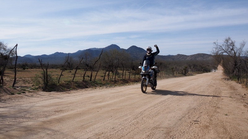 Eric of RIDE Adventures on Baja Dirt Road Giving Fist Bump