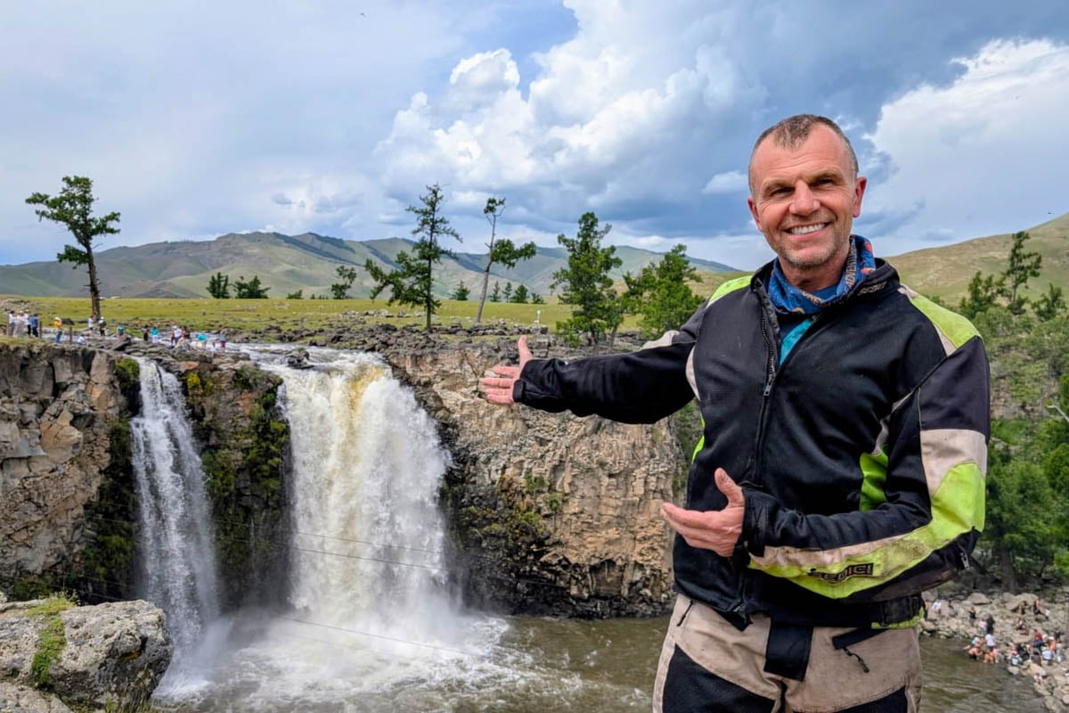 Gilbert smiling showing us the waterfall in mongolia