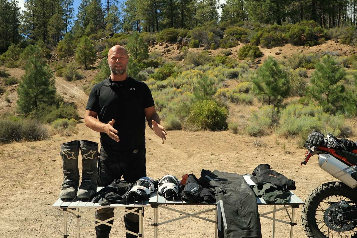 Eric over his table of adventure motorcycle gear.