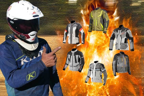 Picture of Eric pointing to all 6 adventure motorcycle jackets being talked about in the article.