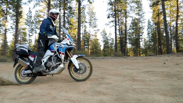 Africa Twin full speed with soft motorcycle bags on the back