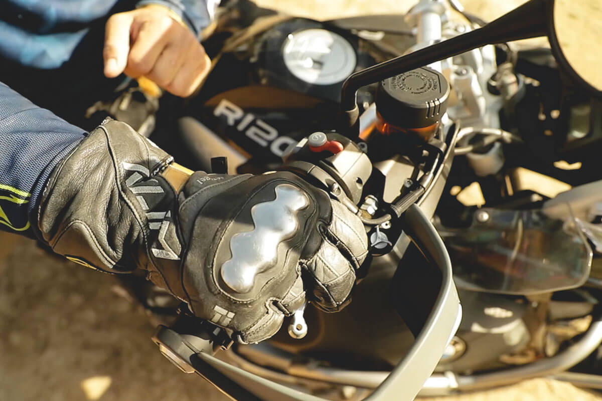 Eric demonstrating how to use the front brake lever adventure motorcycle accessory.