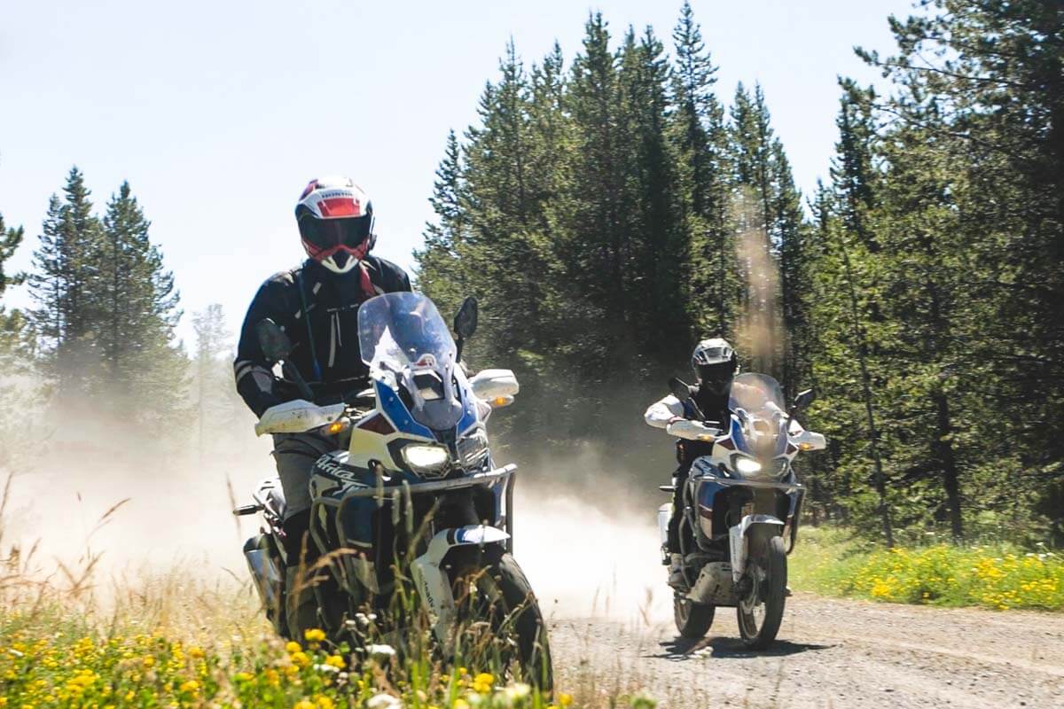 Two adventure motorcycle riders traversing Oregon's backcountry.