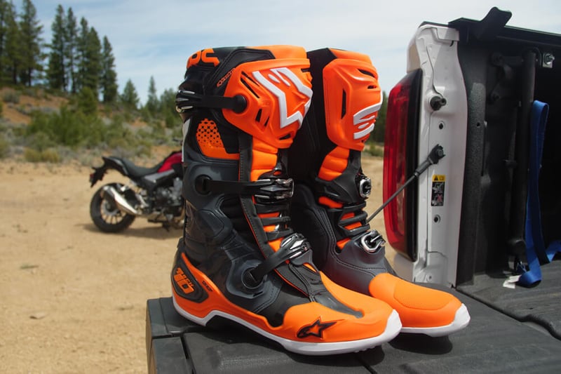 Alpinestars Tech 10 on top of the truck bed.