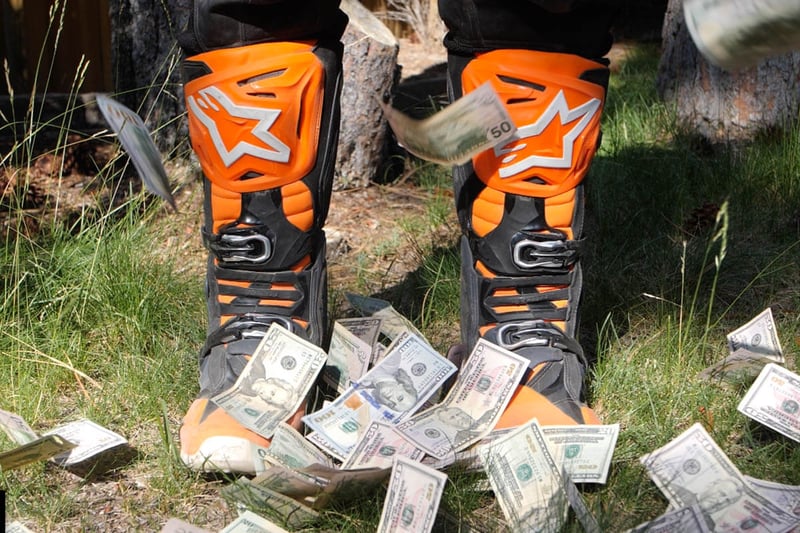 Alpinestars Tech 10 with money raining down on them.