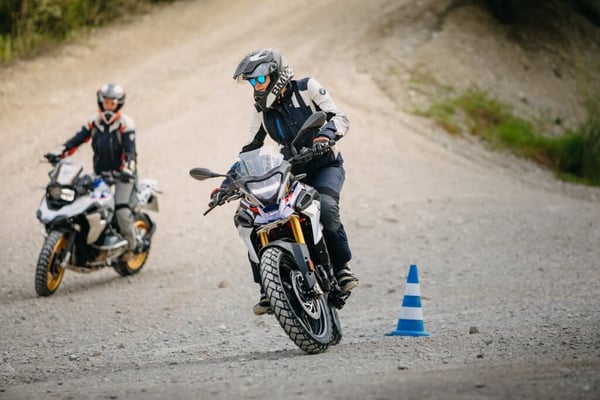 Rider showing how to distribute your weight when motorcycle cornering.