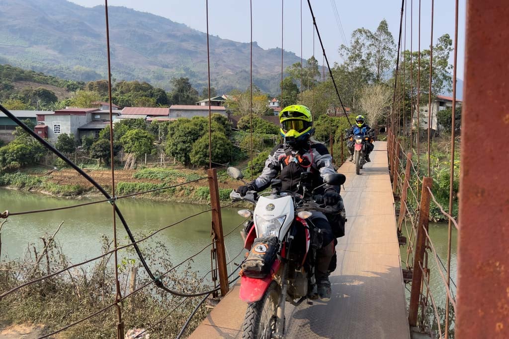 bridge-crossing-wearing-alpinestars-supertech-m8-dirt-bike-helmet