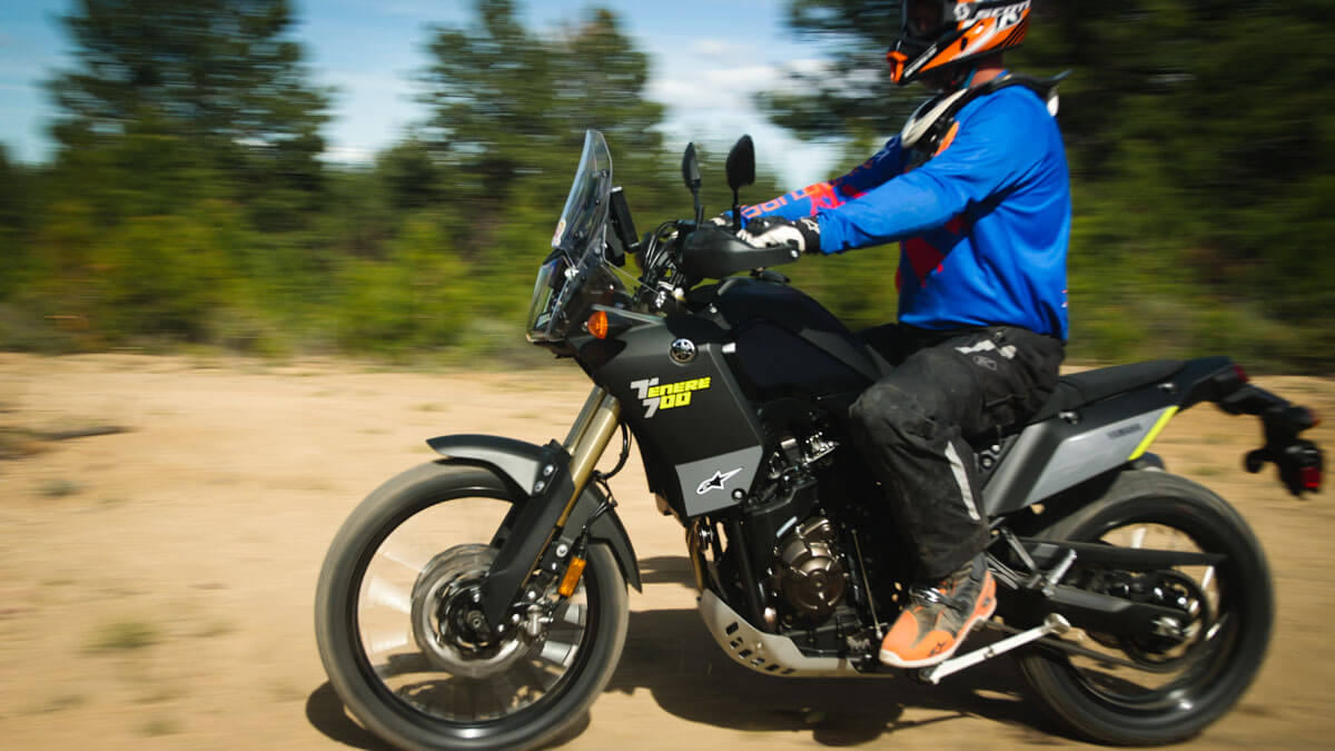 Eric casually riding by on the Tenere 700 to show the bike in motion.