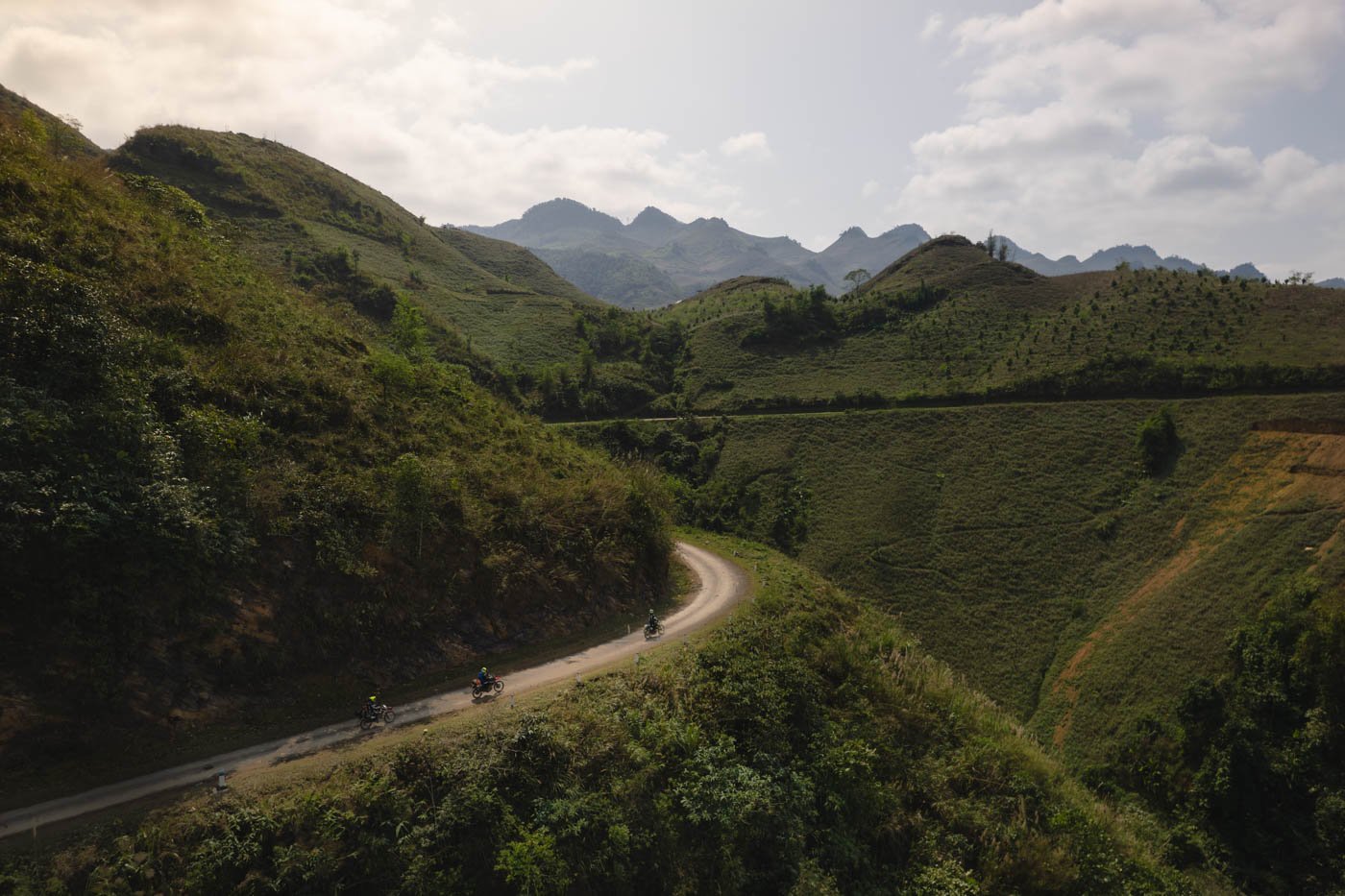 dual-sport-riding-in-a-group-along-a-ridge-in-vietnam