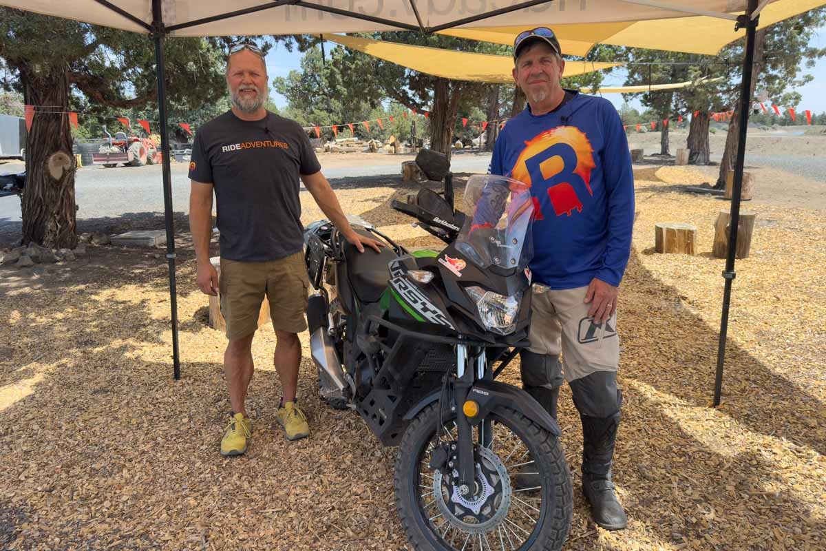 eric and andrew from ride adventures posing in front of versys-x 300