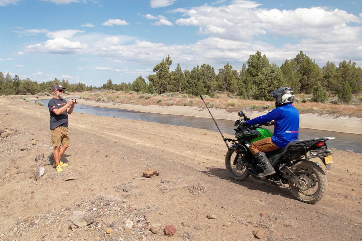 eric taking a video of the versys-x 300 while rider is coming to a stop