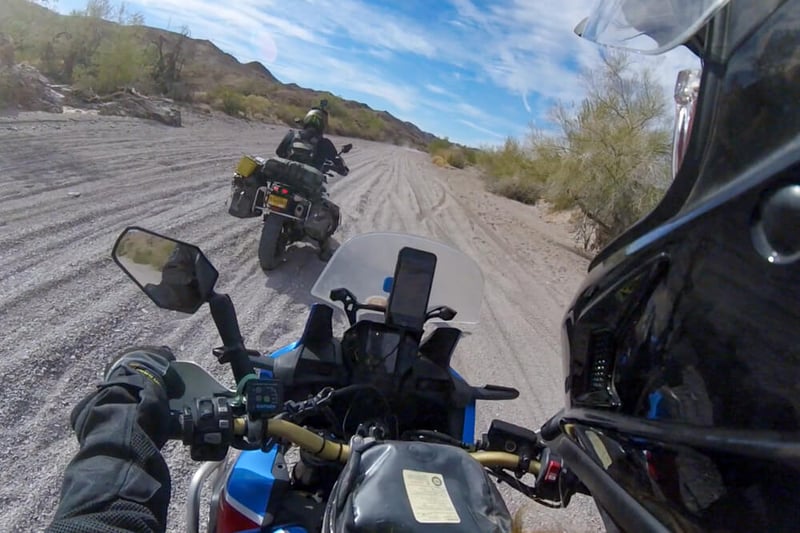Tyler giving Garrett some space while riding in the desert.