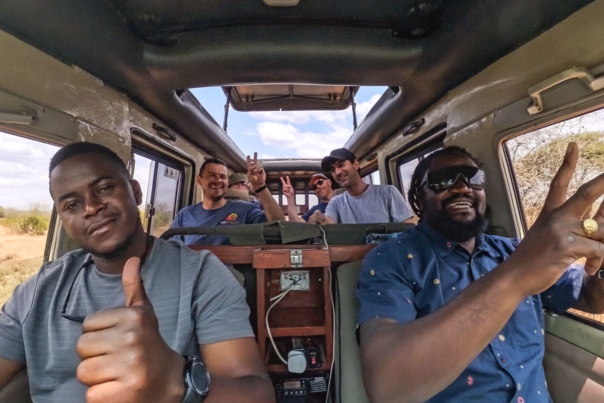 guide-and-driver-smiles-with-guests-tanzania-africa