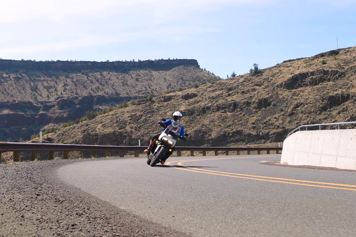 Eric leaning into a corner through a canyon in Eastern Oregon. 