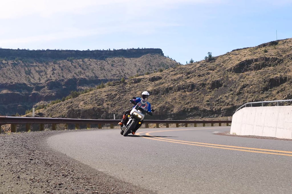 Eric leaning into a corner through a canyon in Eastern Oregon. 