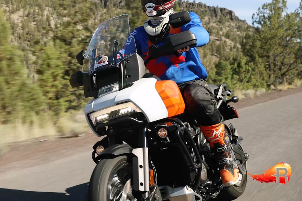 Front view of Eric and Harley Pan America riding down a highway.