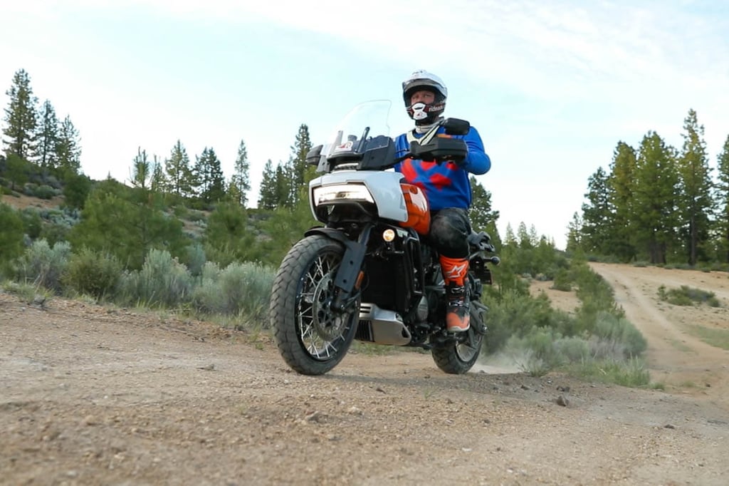 Low hero shot looking up at Eric and the Pan America while riding offraod.