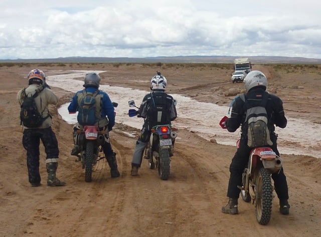 Drz 650 dual sport motorcycle waiting it's turn to cross a river in Bolivia. 