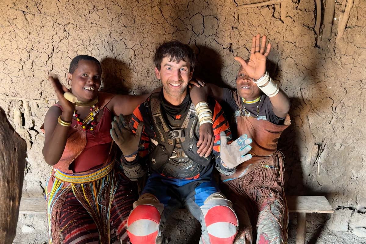 max-meeting-local-women-in-their-mud-hut-tanzania-africa