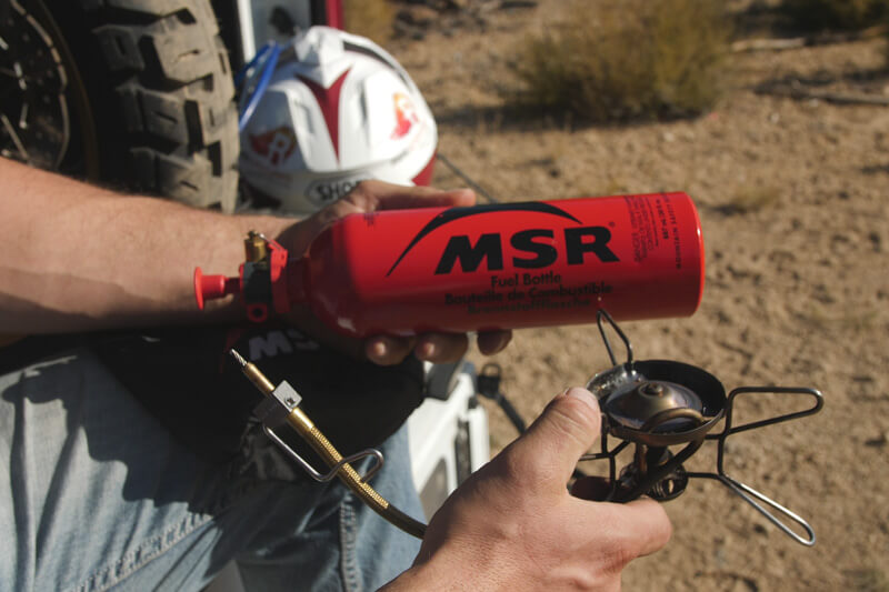 Eric the host from our Youtube holding up the MSR Liquid Fuel Bottle while in the field.