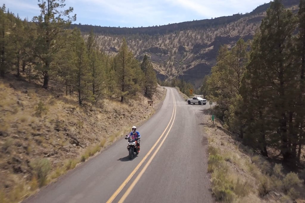 Aerial shot of Eric riding through the canyon on the Pan American. 
