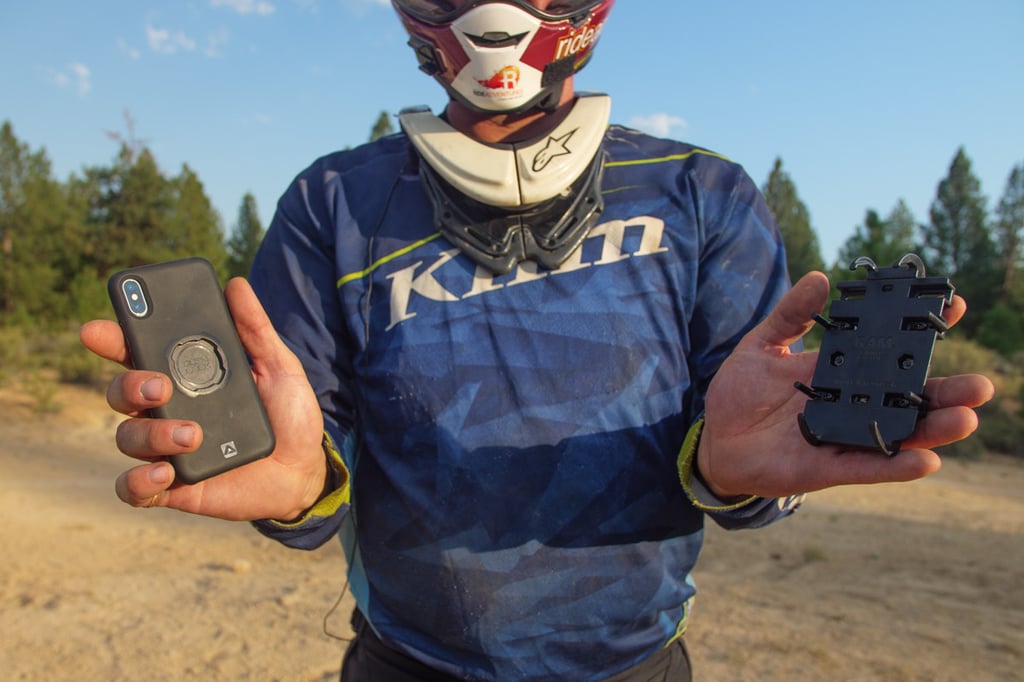 Eric holding two of our favorite phone mounts for your motorcycle.