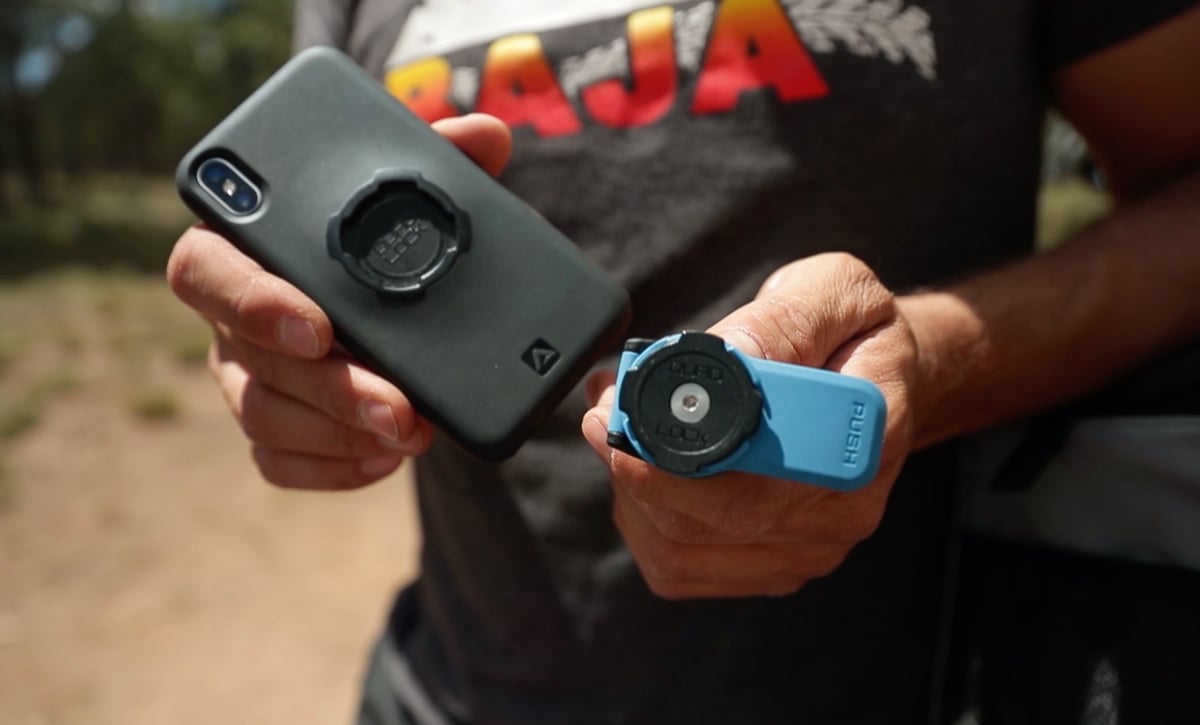 Eric holding the Quadlock Motorcycle mount in his hands while in Baja Mexico.