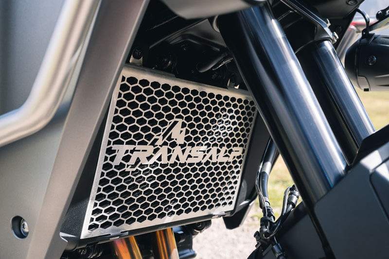Radiator Guard close up shot with custom Honda Transalp logo etched into it.