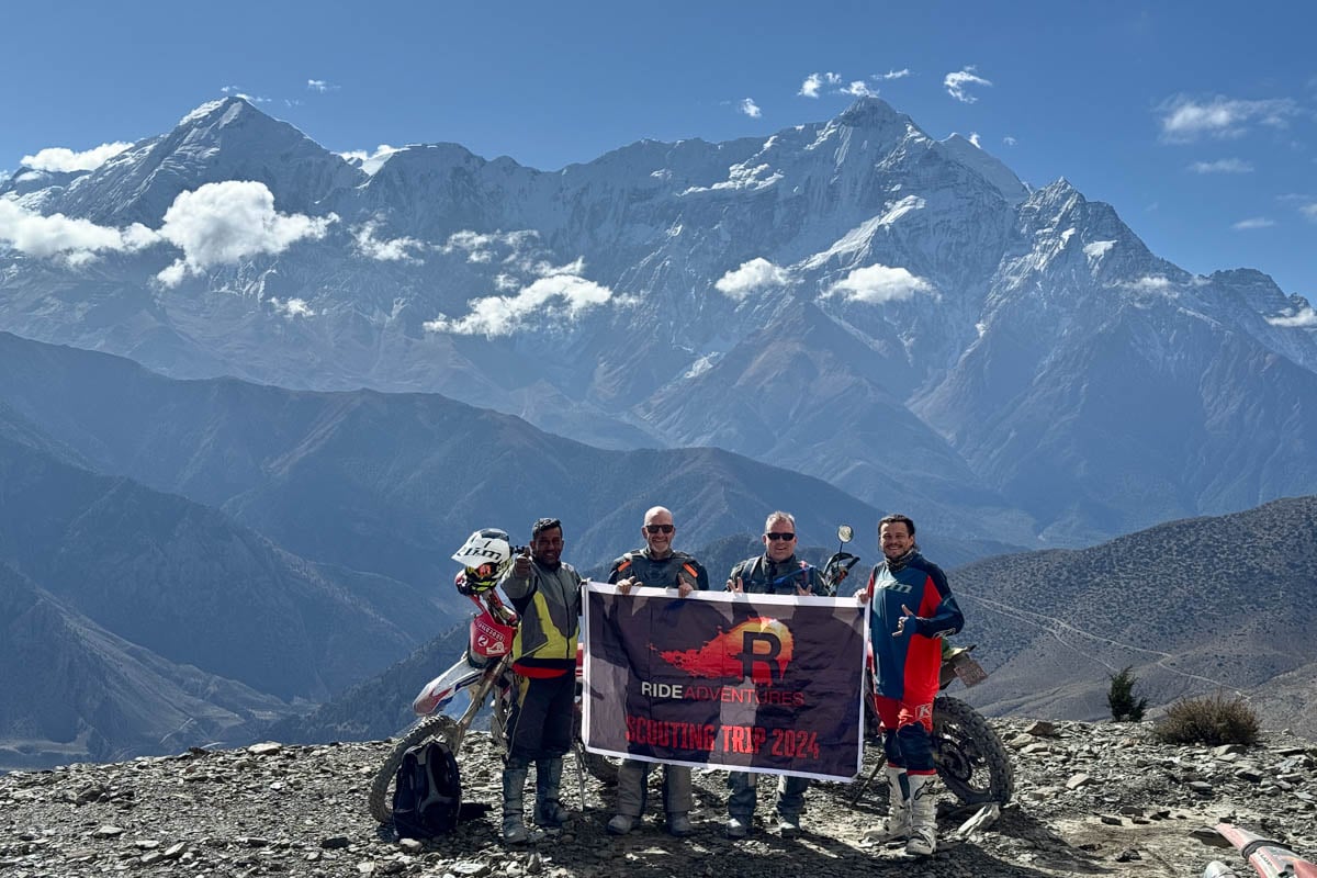 ride-scouting-trip-with-a-group-of-customers-holidng-banner-to-himalayas-nepal-1