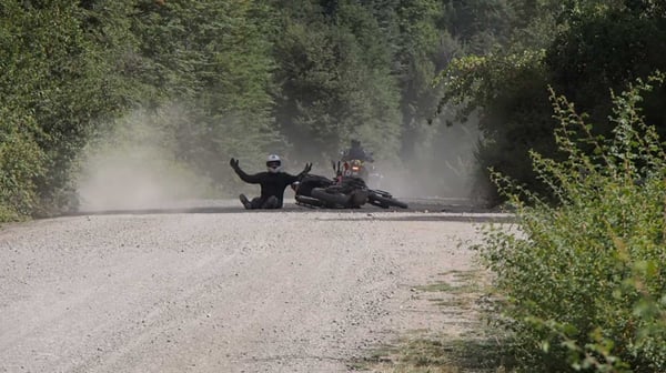 Rider takes a spill with his hands in the air