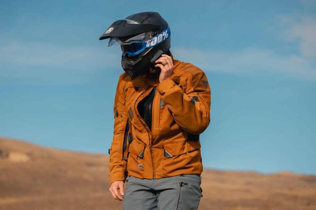 Rider taking a break road side while wearing the Strata 2 motorcycle goggles.