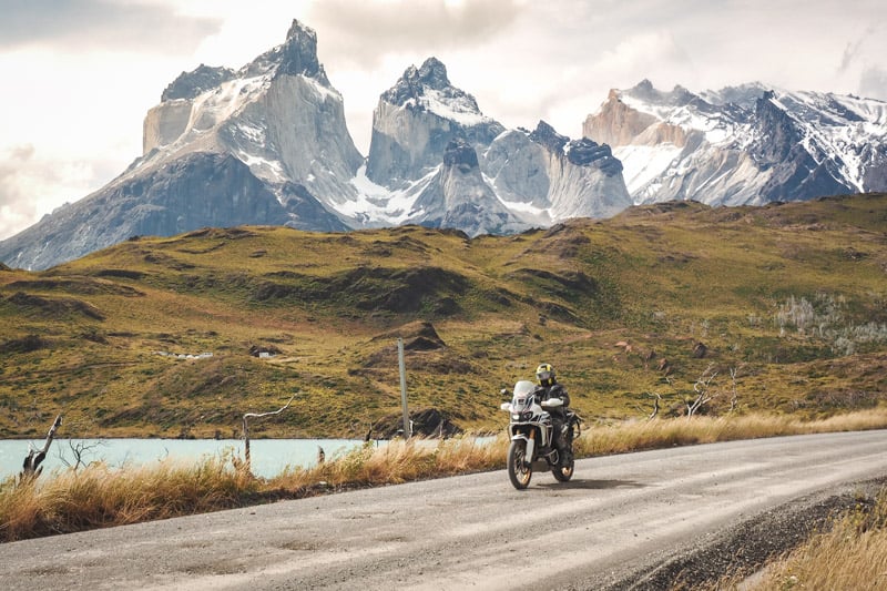 Riding along los cuernos in Patagonia while on a motorcycle holiday