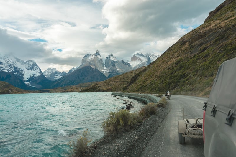 View of road and Rider behind our support truck in Patagonia