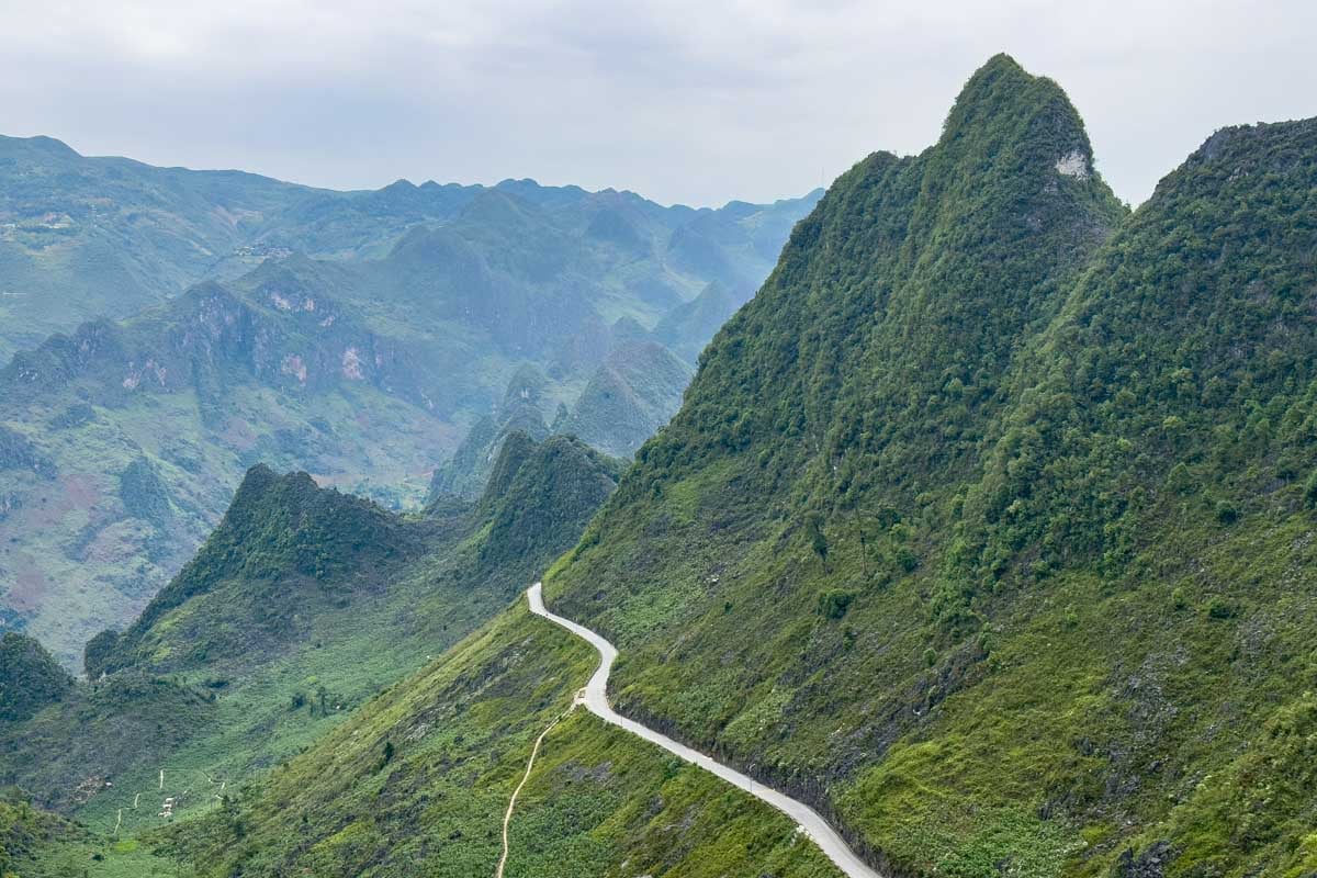 road-along-side-massive-mountain-in-ha-giang-vietnam