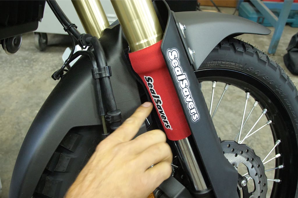 Tyler installing a Sealsavers sock. 
