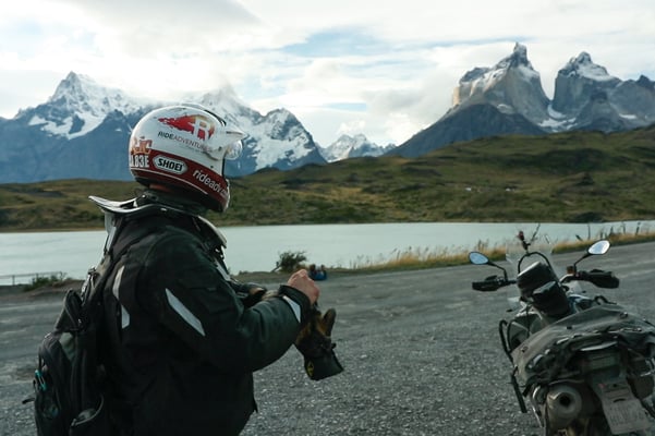 Eric enjoying the view of the Torres del Paine mountains with his Shoei Hornet X2 helmet in Patagonia.