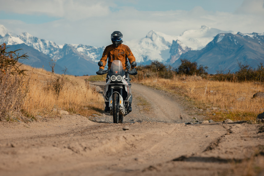 ADV rider standing to get better airflow while wearing the Strata 2 motorcycle goggles.