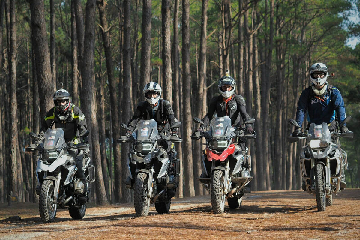 The gang lines up riding in formation while sporting the Mitas E-07 adventure motorcycle tires. 