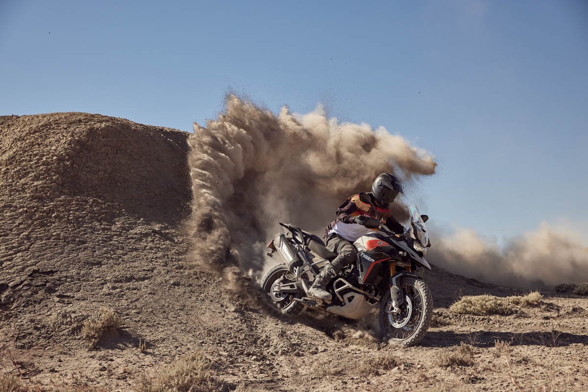 tiger-900-rally-pro-kicking-up-dirt-on-berm