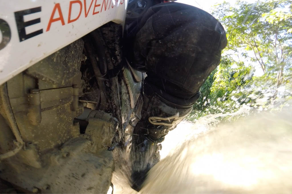 Garrett in Colombia riding with the Toucans through some gnarly water crossings.